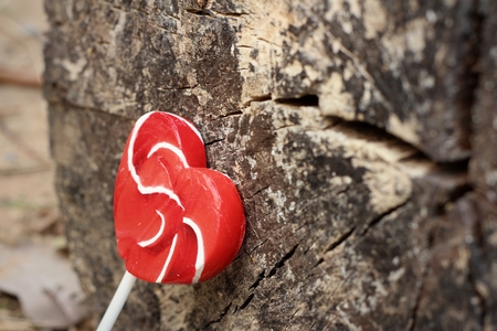Candy valentines hearts on a background of wooden.の写真素材