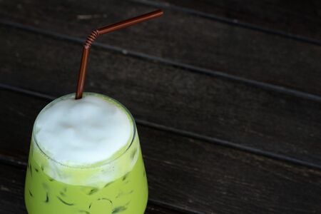 Latte Green tea and milk on a tableの写真素材