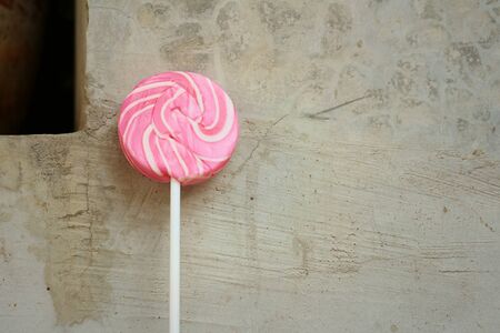 Candy valentines on cement background at the park.の写真素材
