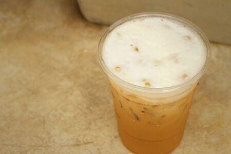 Iced coffee on a background of cement.の写真素材