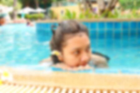 blurred image of woman in a swimming pool.の写真素材