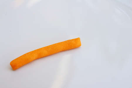 bread sticks in white plate on a tableの写真素材