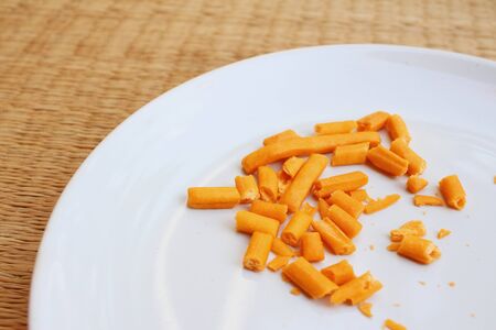 bread sticks in white plate on a tableの写真素材
