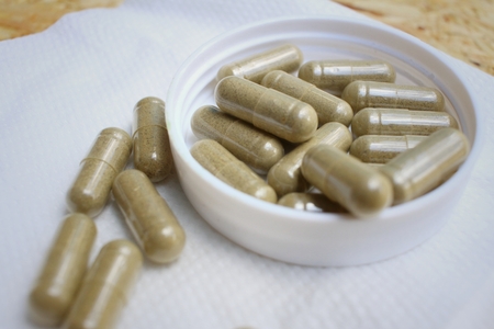 Medical pill on background of  wooden table.の写真素材