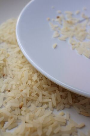 White grain rice on a white plate.の写真素材