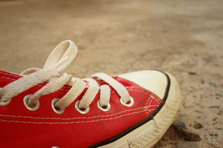Red shoes on the floor of cement.の写真素材