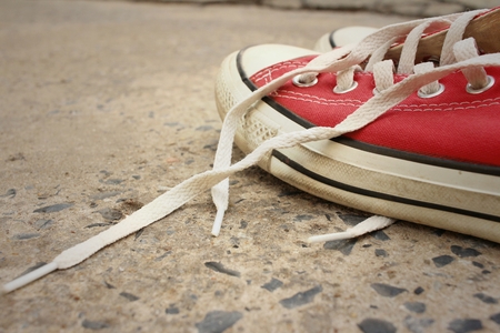 Red shoes on the floor of cement.の写真素材
