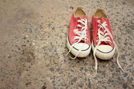 Red shoes on the floor of cement.の写真素材