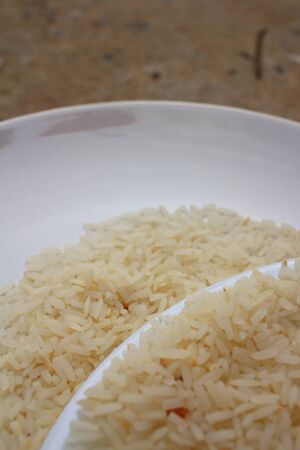 White grain rice on a white plate.の写真素材