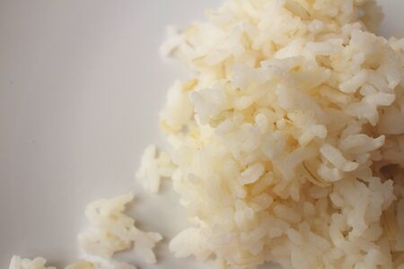 Rice on white plate on wooden background.の写真素材