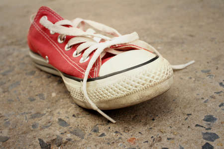 Red shoes on the floor of cement.の写真素材