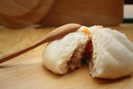steamed dumpling - chinese bun on brown background.の写真素材