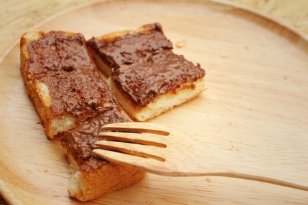 bread topped with chocolate in a plateの写真素材