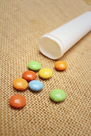 Colorful of chocolate isolated on brown backgroundの写真素材