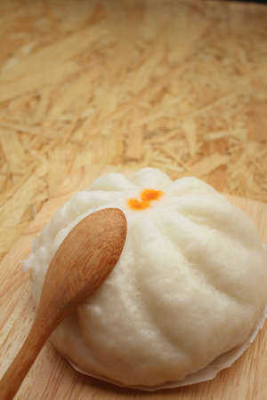 steamed dumpling - chinese bun on brown background.の写真素材