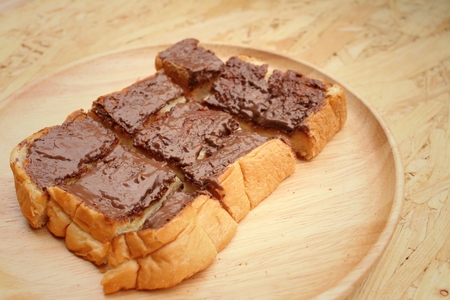 bread topped with chocolate in a plateの写真素材