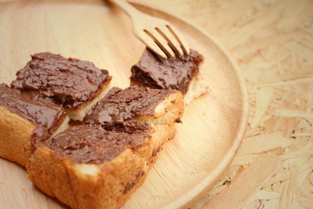 bread topped with chocolate in a plateの写真素材