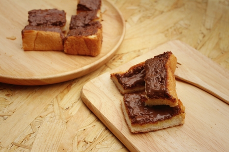 bread topped with chocolate in a plateの写真素材