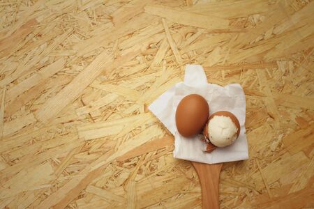 Boil eggs on background of brown wooden.