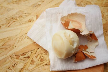Boil eggs on background of brown wooden.の写真素材