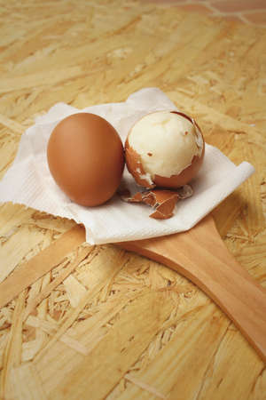 Boil eggs on background of brown wooden.の写真素材