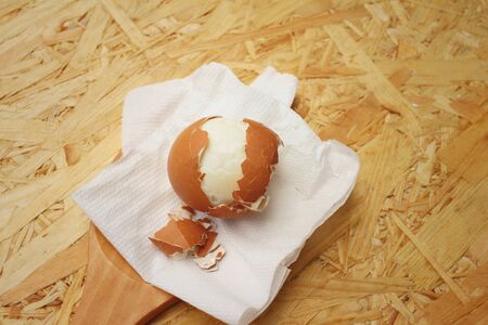 Boil eggs on background of brown wooden.の写真素材
