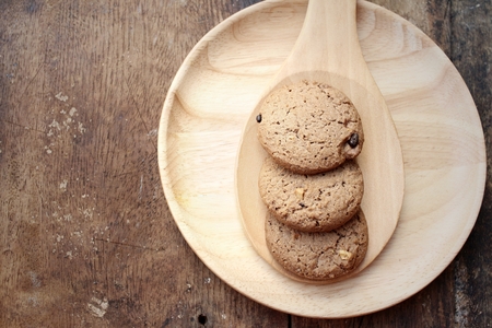 Chocolate chip cookies on background of brown.