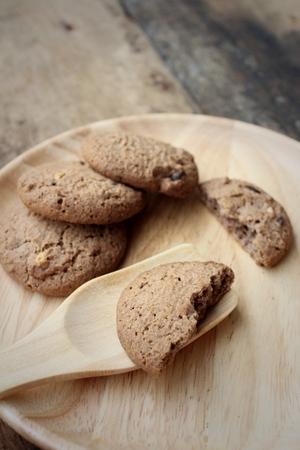 Chocolate chip cookies on background of brown.の写真素材