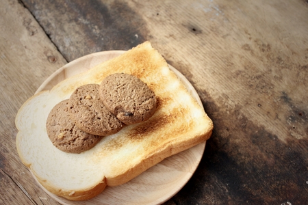 Cookies with breads on background of brown.