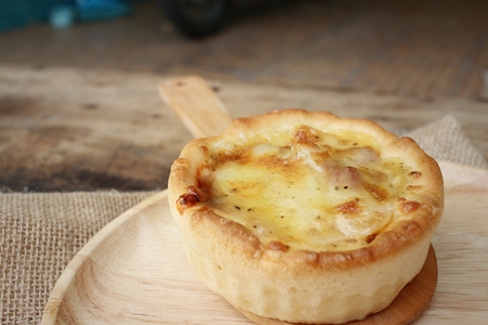 Crispy homemade Pizza on background of brown.の写真素材