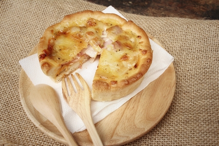 Crispy homemade Pizza on background of brown.