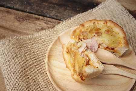 Crispy homemade Pizza on background of brown.の写真素材