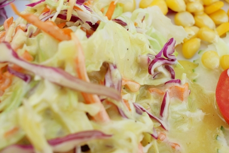 Salad in plate on a table at restuarant.の写真素材