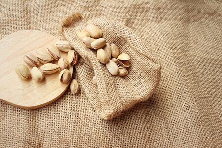 Pistachios nuts on a background of brown