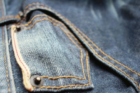Background or texture of blue torn jeans.