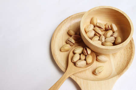 Pistachios nuts on a background of white