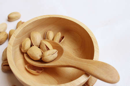 Pistachios nuts on a background of whiteの写真素材