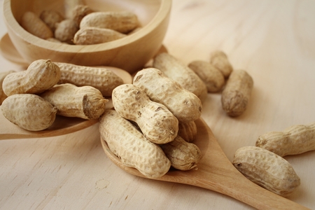 Peanut on background of a brown wood.の写真素材