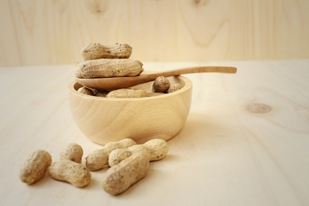 Peanut on background of a brown wood.の写真素材