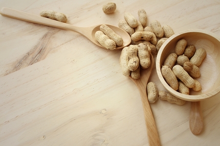 Peanut on background of a brown wood.の写真素材