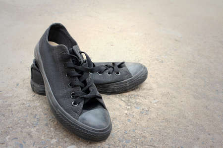 Black shoes on a background of cement.の写真素材