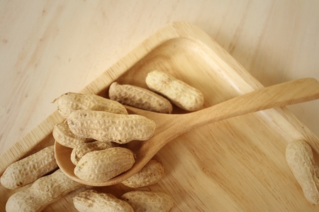 Peanut on background of a brown wood.の写真素材