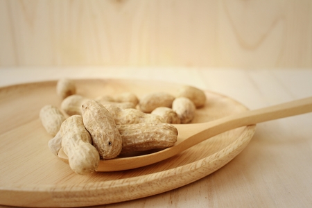 Peanut on background of a brown wood.の写真素材