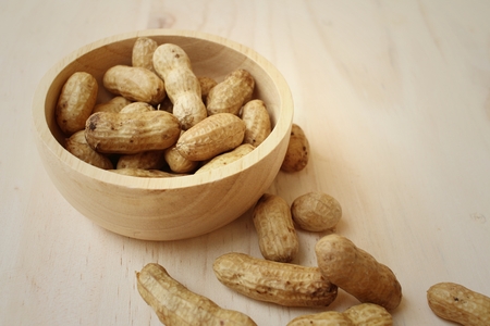 Peanut on background of a brown wood.の写真素材