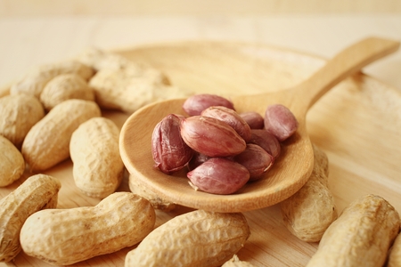 Peanut on background of a brown wood.の写真素材