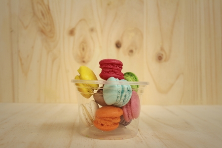 Colorful of macarons on background of brown wood.の写真素材