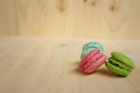 Colorful of macarons on background of brown wood.の写真素材
