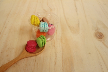 Colorful of macarons on background of brown wood.の写真素材