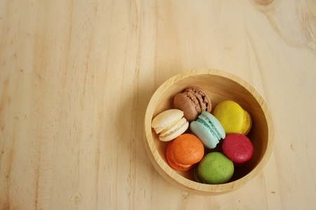 Colorful of macarons on background of brown wood.の写真素材