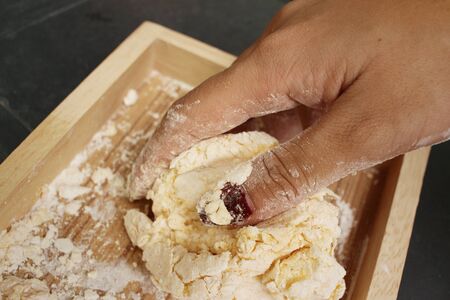 Mix eggs with flour to make cakes.